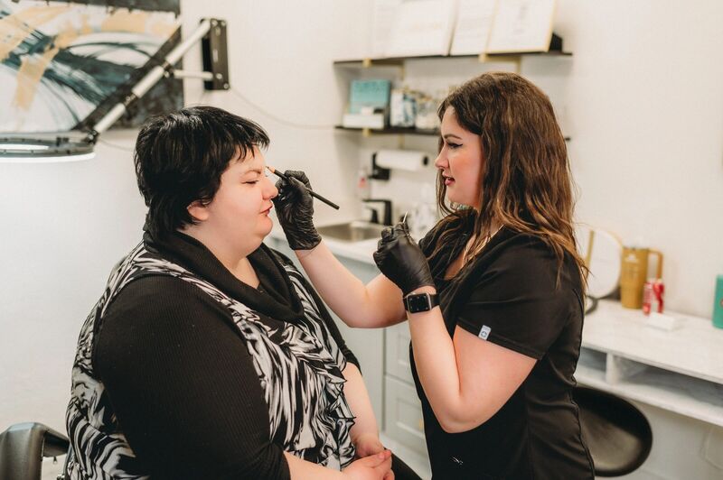 Rachel working on a client in her Petoskey studio
